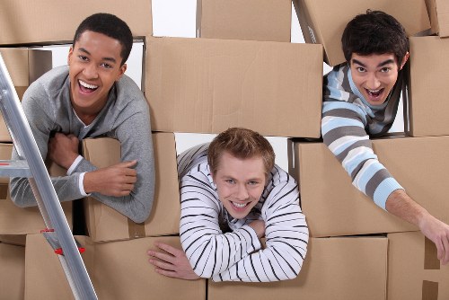 Careful loading of sofas and house furniture for a move in Chelsea
