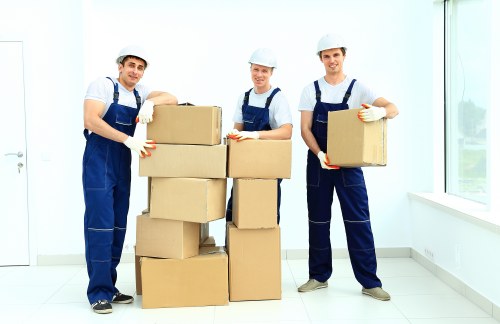 Removal team preparing a Chelsea home move with boxes and furniture