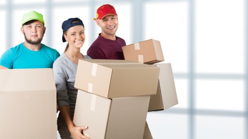 Labelled moving boxes and packing materials prepared for a Chelsea property