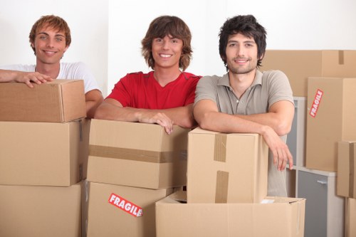Removal team planning a flat move in a Chelsea street