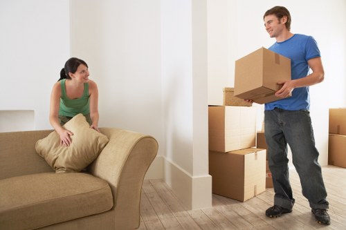 Local moving team handling boxes and furniture in Chelsea properties